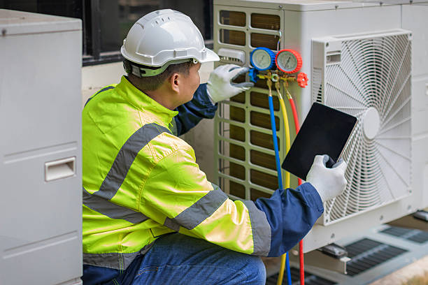 Professional Air Conditioning Repair technician working in Hingham, MA